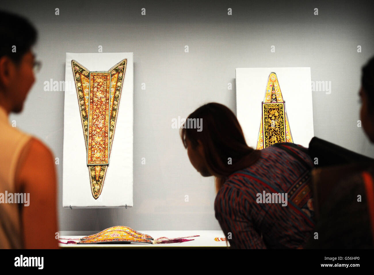 Singapore. 21st June, 2016. People look at Nyonya needlework at the