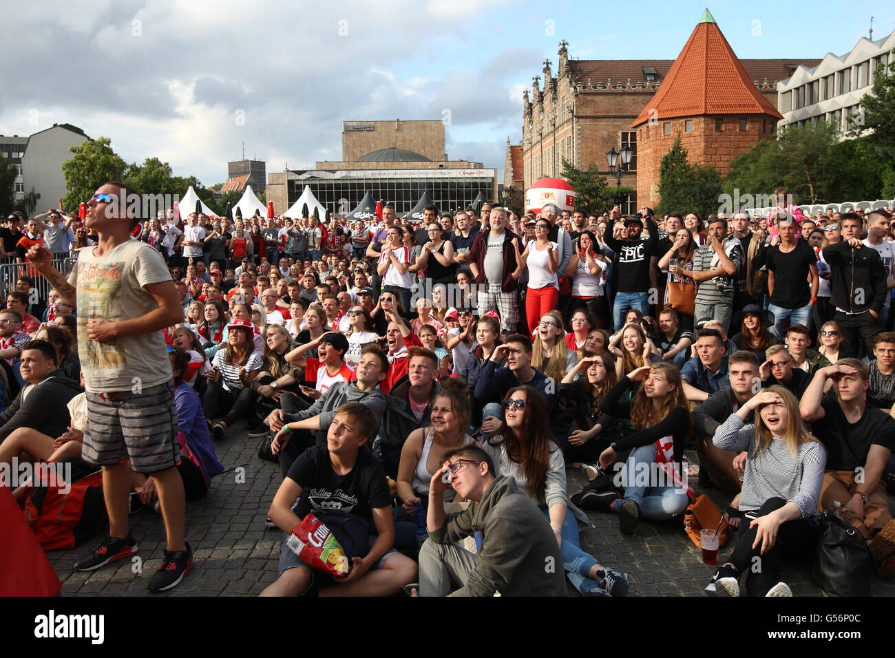 Gdansk, Poland 21st, June 2016 Fan zone in Gdansk city centre during the  UEFA EURO 2016 game in France. Polish football team fans react during the  Poland v Ukraine game Credit: Michal