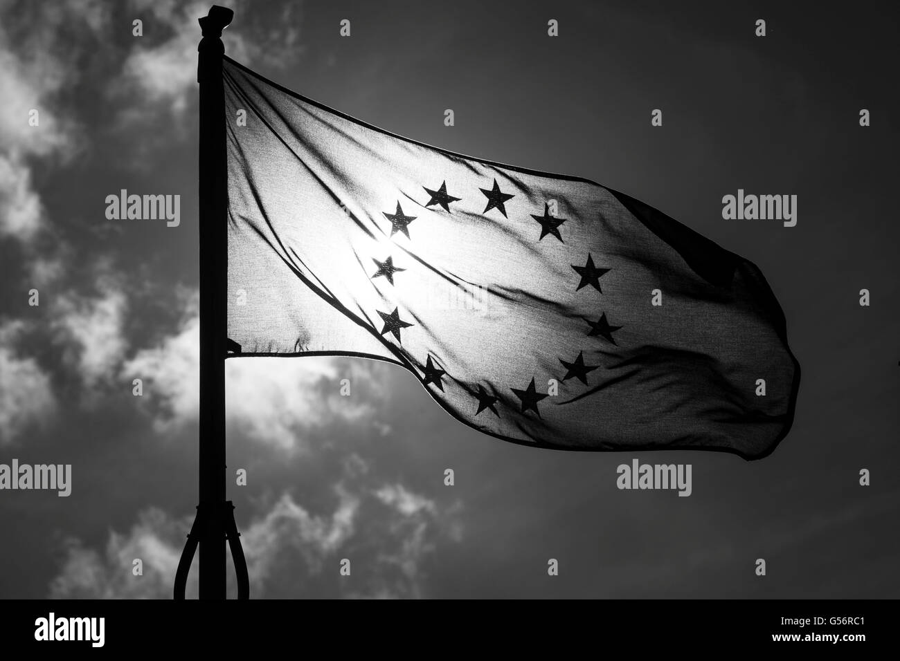 Cardiff, UK. 21st June, 2016. A European Union flag silhouetted against the sun outside City Hall in Cardiff, South Wales. Britain goes to the polls for a referendum to decide on its continued EU membership on June 23.  Credit:  Matthew Horwood / Alamy Live News Stock Photo