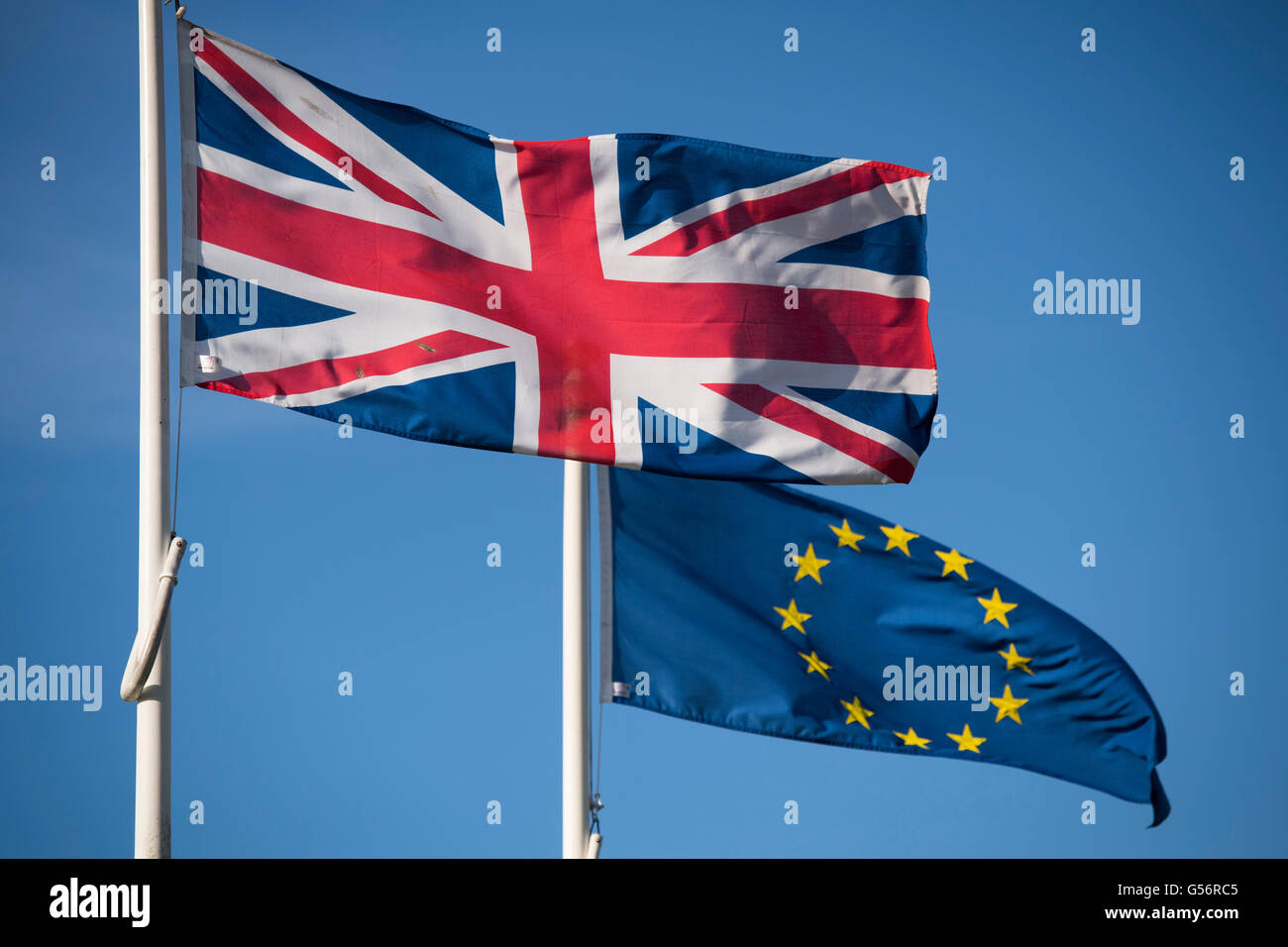 Cardiff, UK. 21st June, 2016. The national flag of the United Kingdom the Union Jack flag and the  European Union flag outside City Hall in Cardiff, South Wales. Britain goes to the polls for a referendum to decide on its continued EU membership on June 23.  Credit:  Matthew Horwood / Alamy Live News Stock Photo