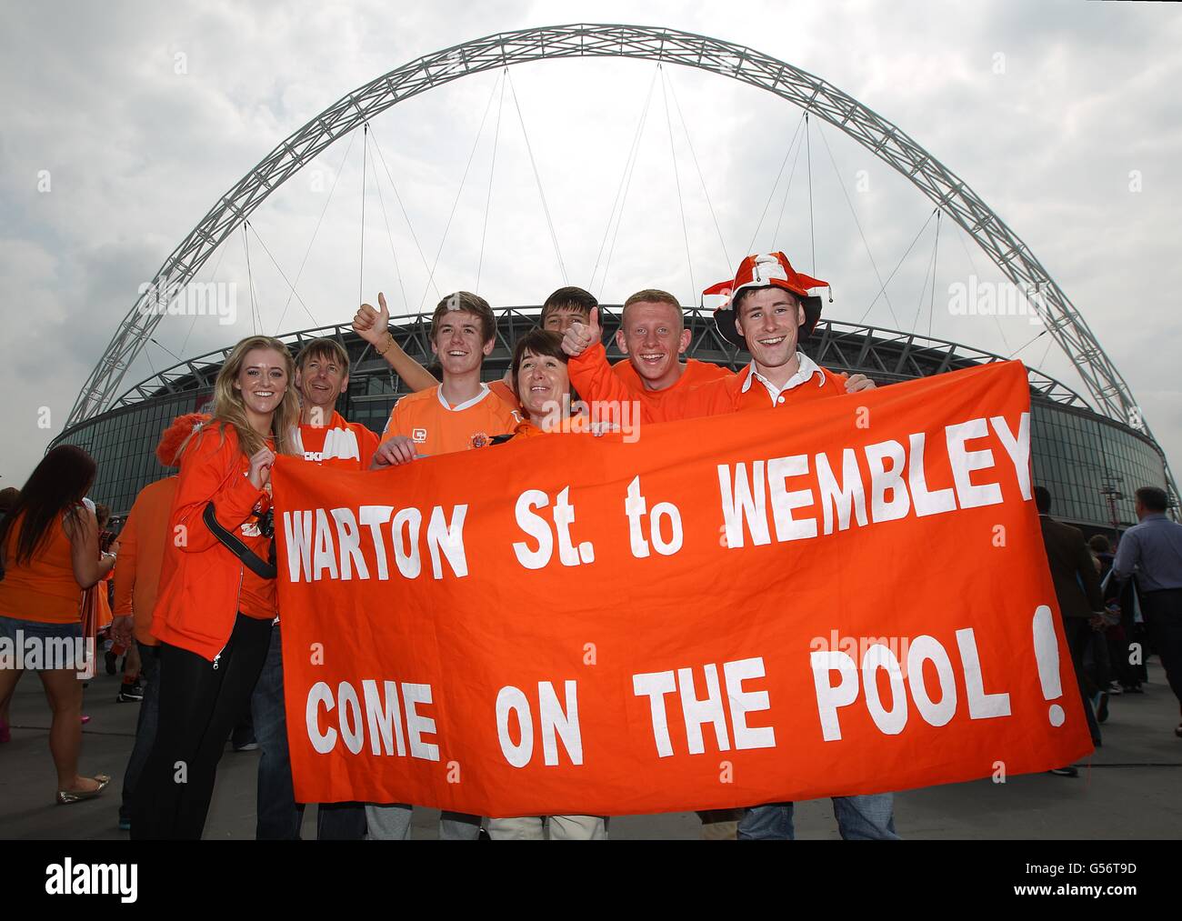 Fans show their support outside the ground the game hires stock