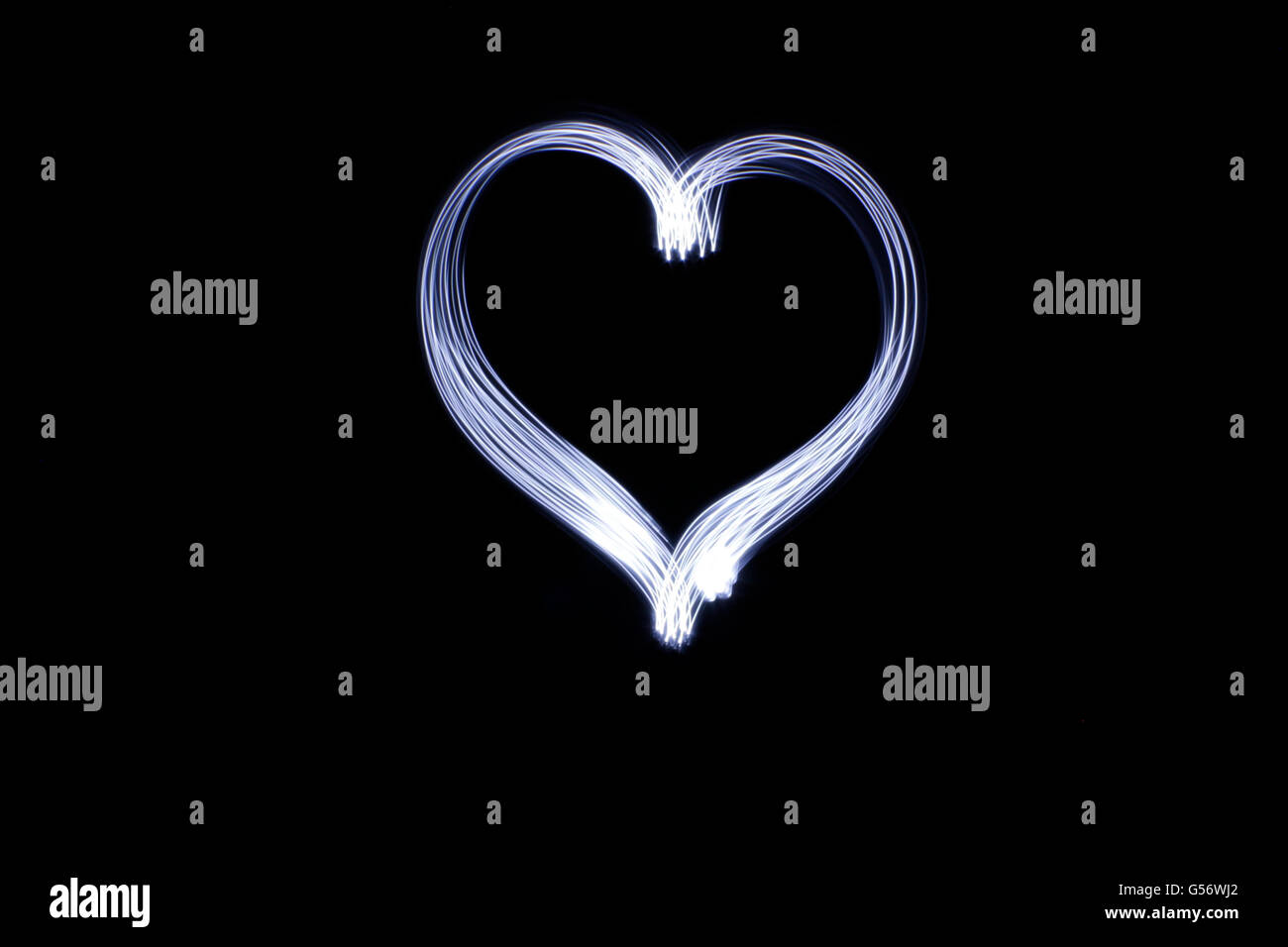 Photograph of a heart drawing made with long exposure light effect