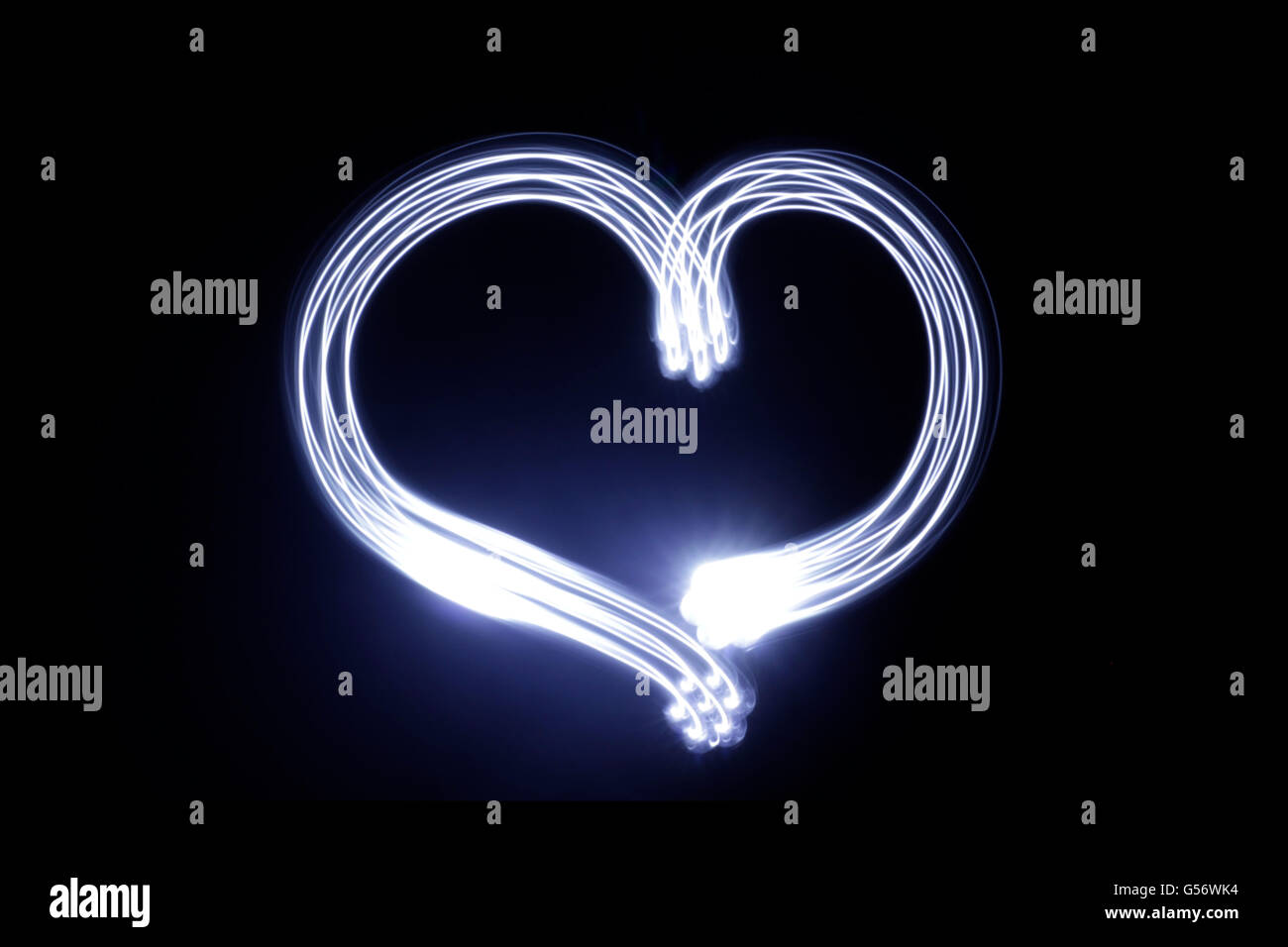 Photograph of a heart drawing made with long exposure light effect