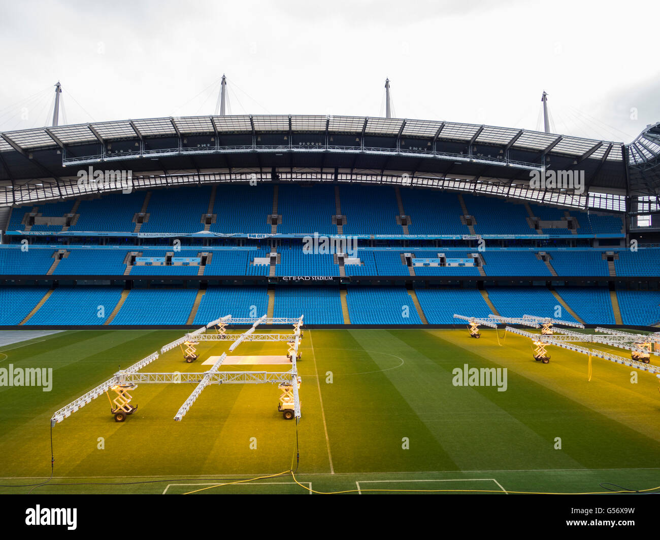 Lighting rigs to provide artificial sunlight in winter for the grass on the pitch , Etihad Stadium Manchester City UK Stock Photo