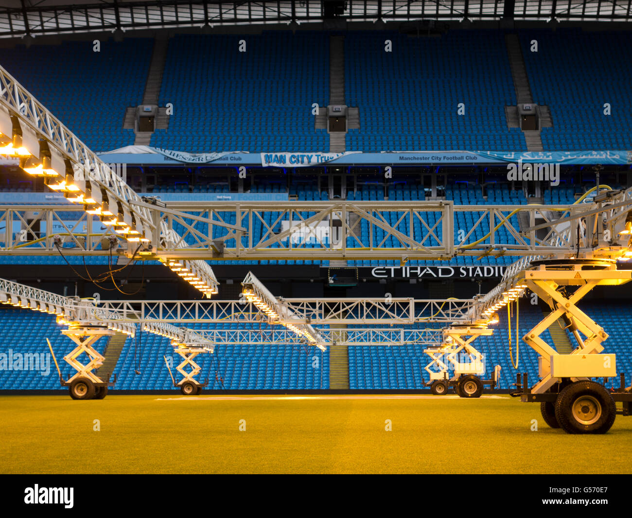 Lighting rigs to provide artificial sunlight in winter for the grass on the pitch , Etihad