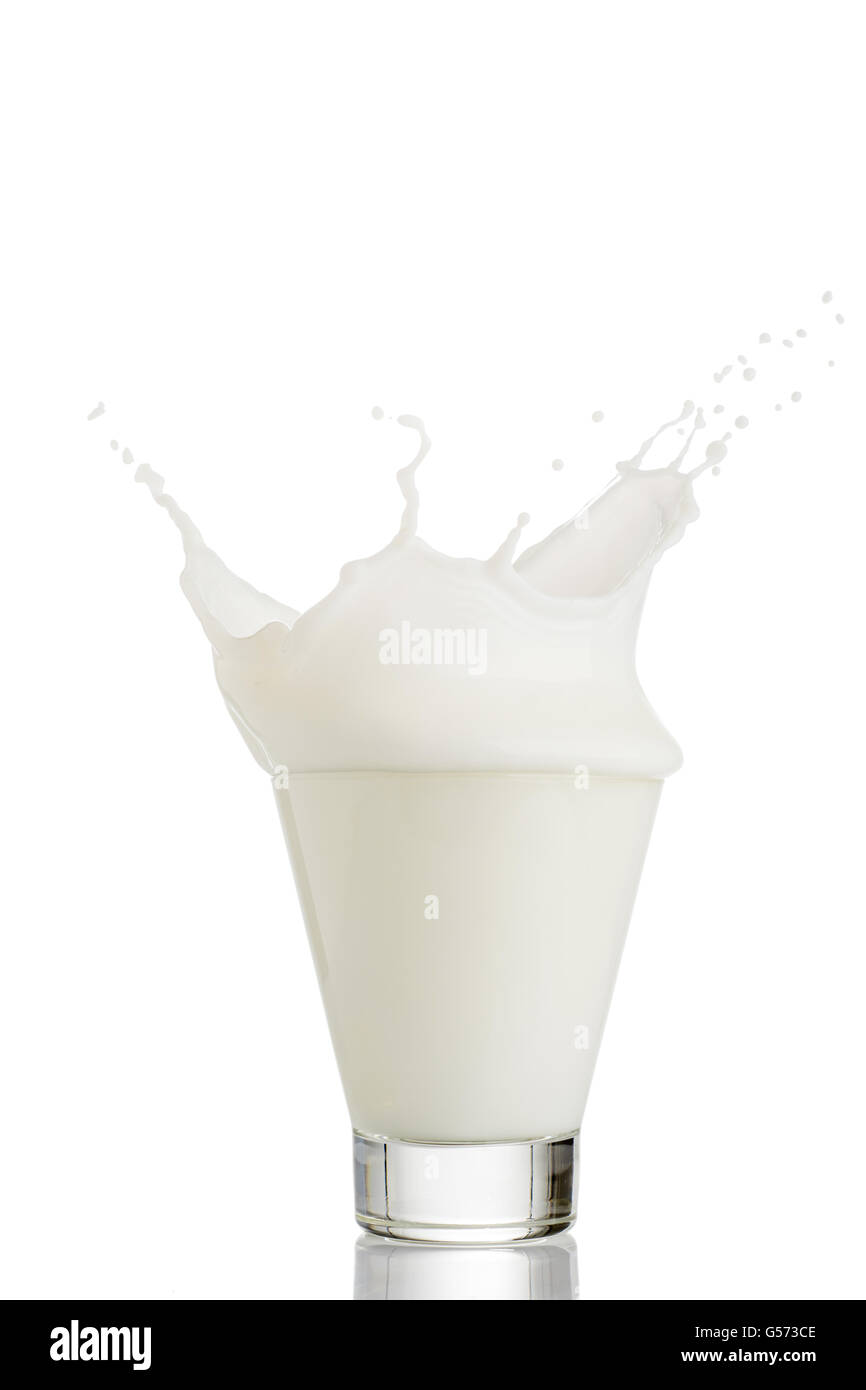 milk splash in glass isolated on white background Stock Photo - Alamy