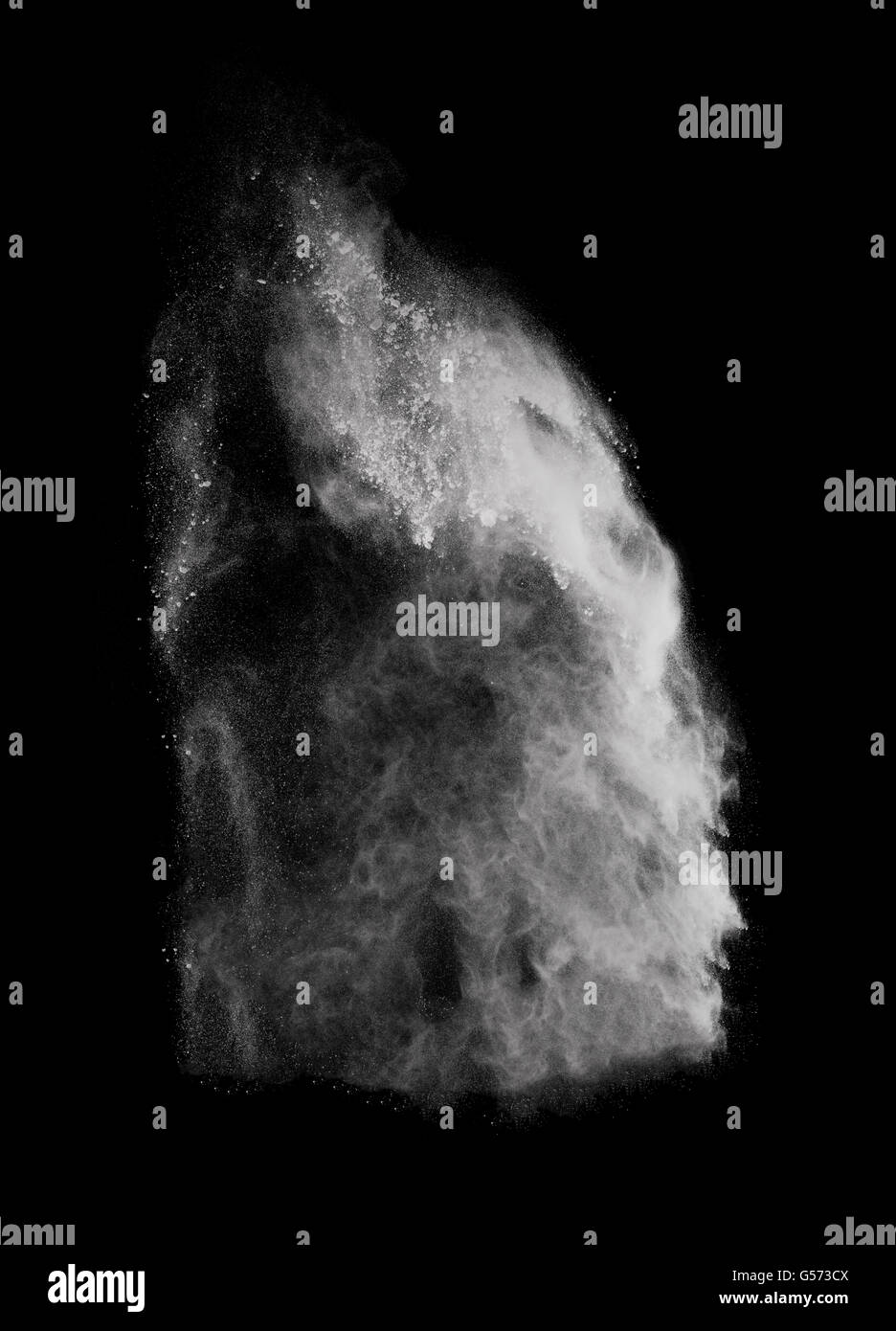 White powder explosion isolated on black background Stock Photo - Alamy