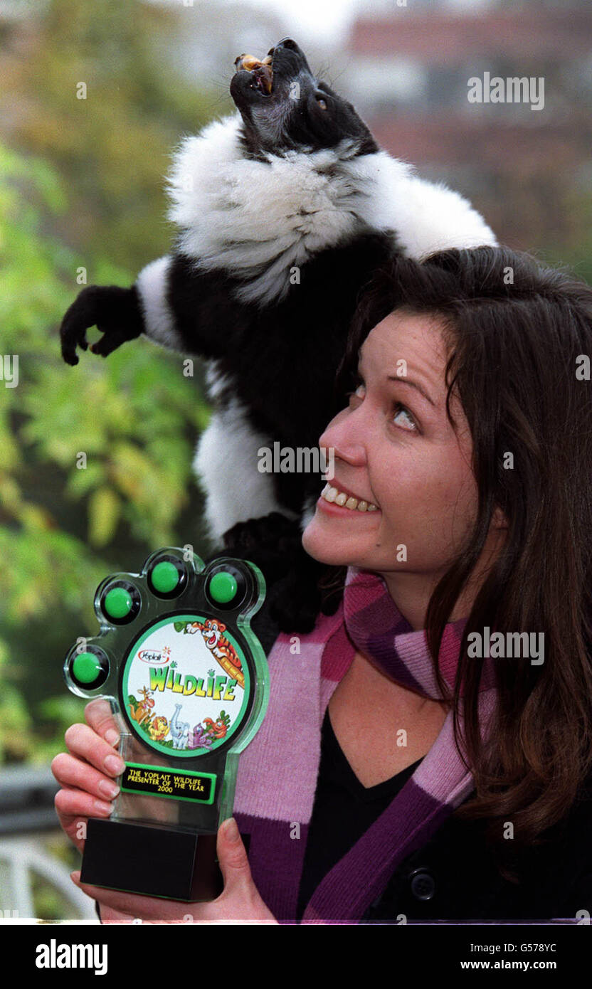 BBC presenter Charlotte Uhlenbroek, winner of the Yoplait Wildlife Presenter of the Year Award 2000, with her trophy and Dana, a 10 year old black and white ruffed lemur from Madagascar at London Zoo. * The Award was created and sponsored by Yoplait Wildlife, which gives money to London Zoo's Conservation in Action programme. Stock Photo