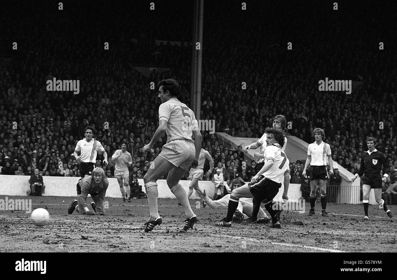 Kenny Dalglish ( on ground) slides the ball past Manchester United 'keeper Gary Bailey (left-on knees) to put Liverpool in the lead after 17 minutes of the FA Cup semi-final at Maine Road, Manchester. Stock Photo