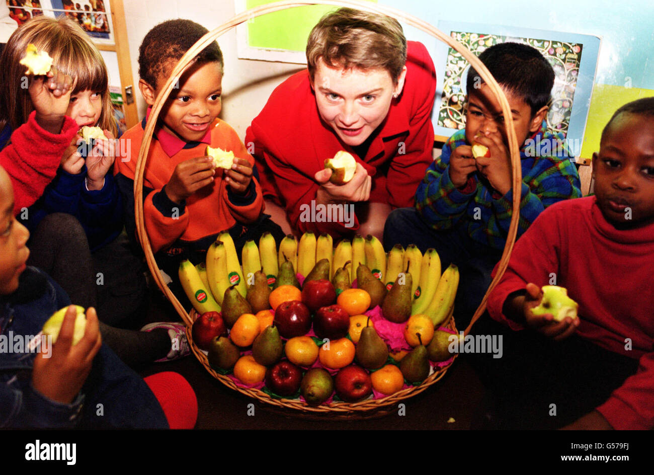 Yvette Cooper Minister of Health (centre) with children from Vauxhall