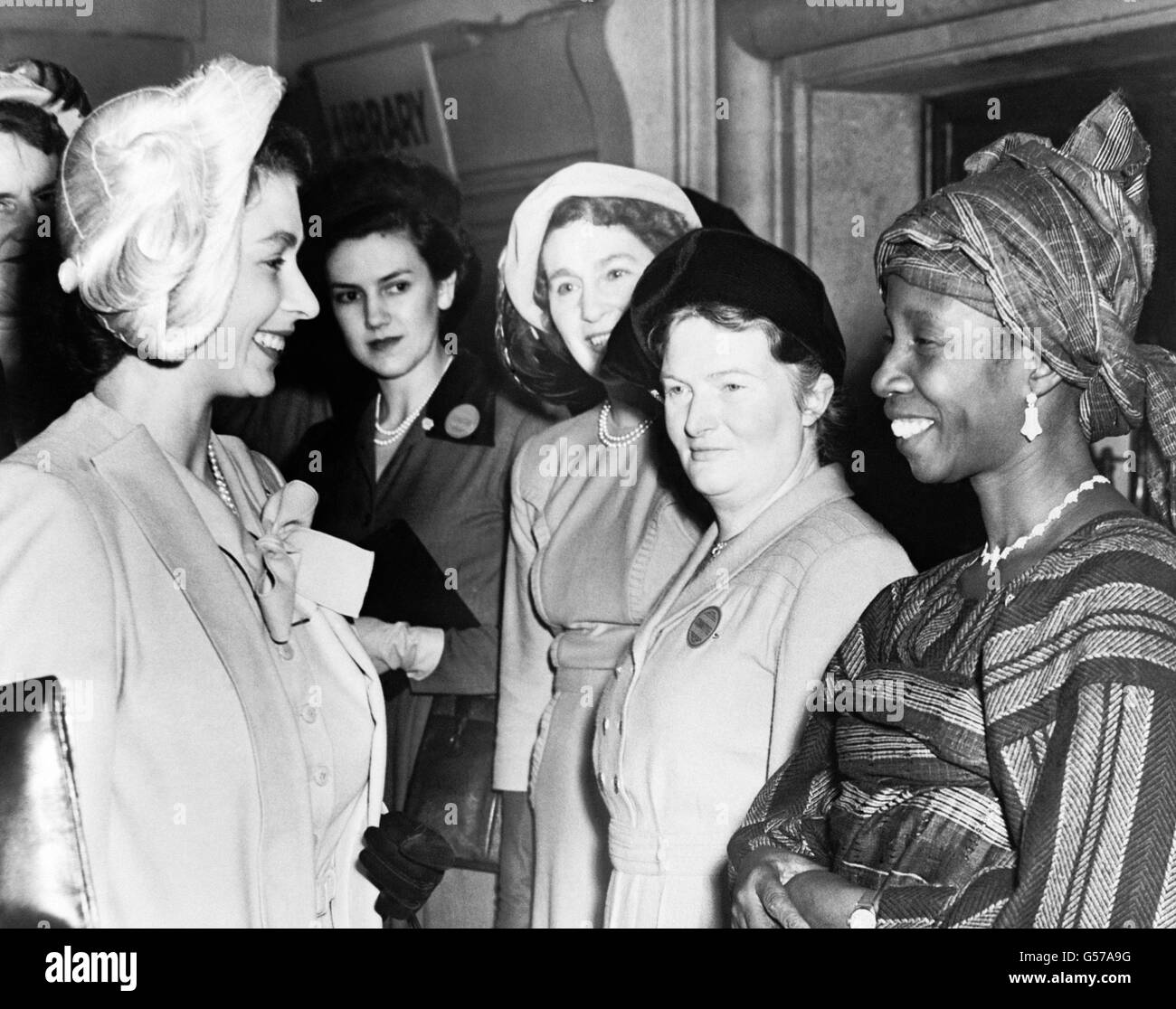 Princess Elizabeth meeting Mrs S.I Kale of Lagos, Nigeria, at a meeting of young members of the Mothers' Union at Central Hall, Westminster, London Stock Photo