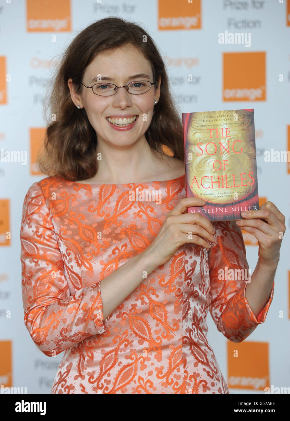 Madeline Miller poses with her book The Song of Achilles during
