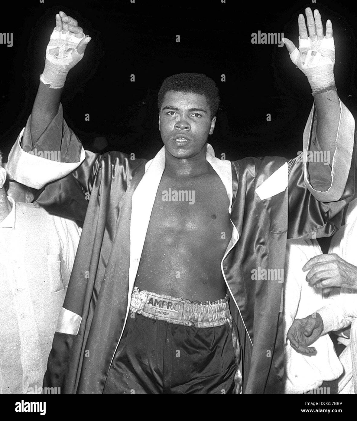 Cassius Clay, the Louisville Lip, doesn't appear jubilant at his victory over British Heavyweight champion Henry Cooper at Wembley, London. Stock Photo