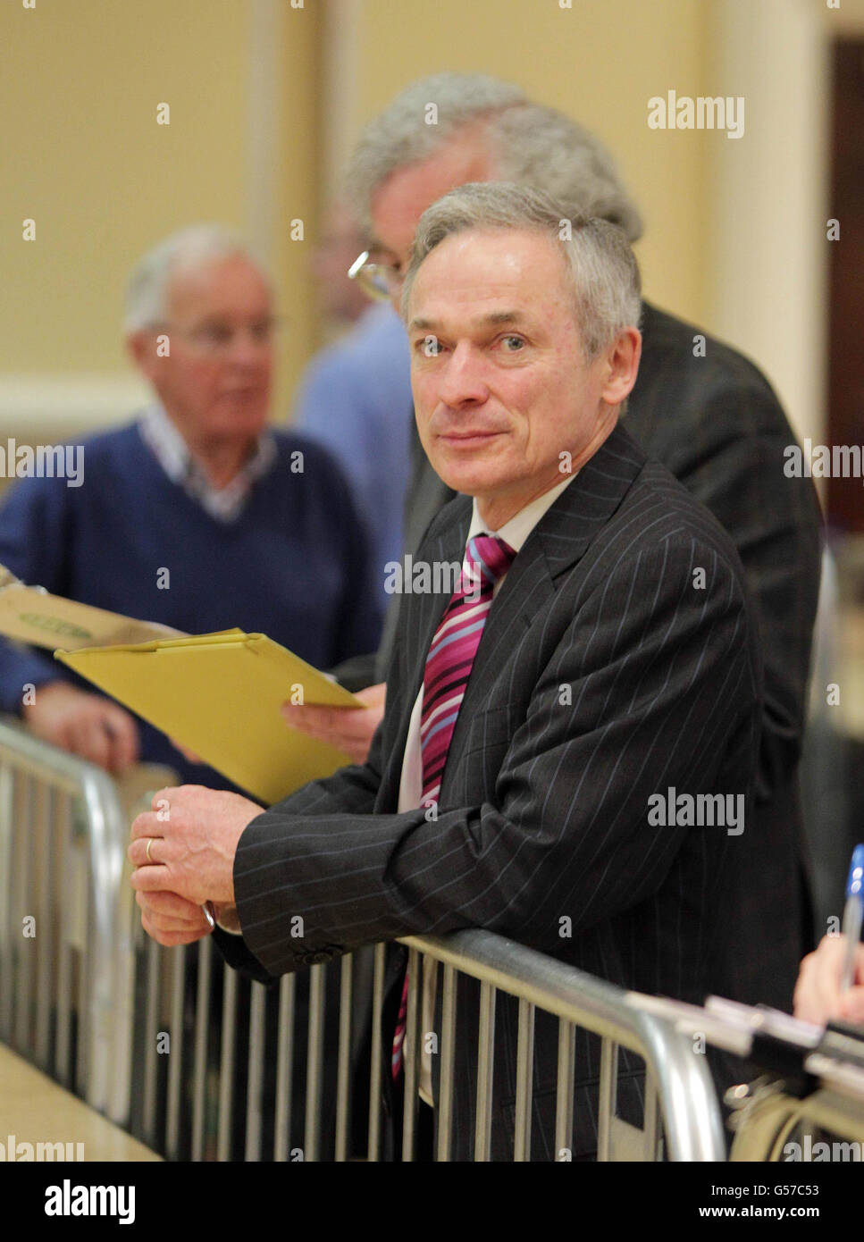 Jobs Minister Richard Bruton watches as the counting begins in the European Fiscal Treaty Referendum at the Citywest Hotel in Dublin. Stock Photo