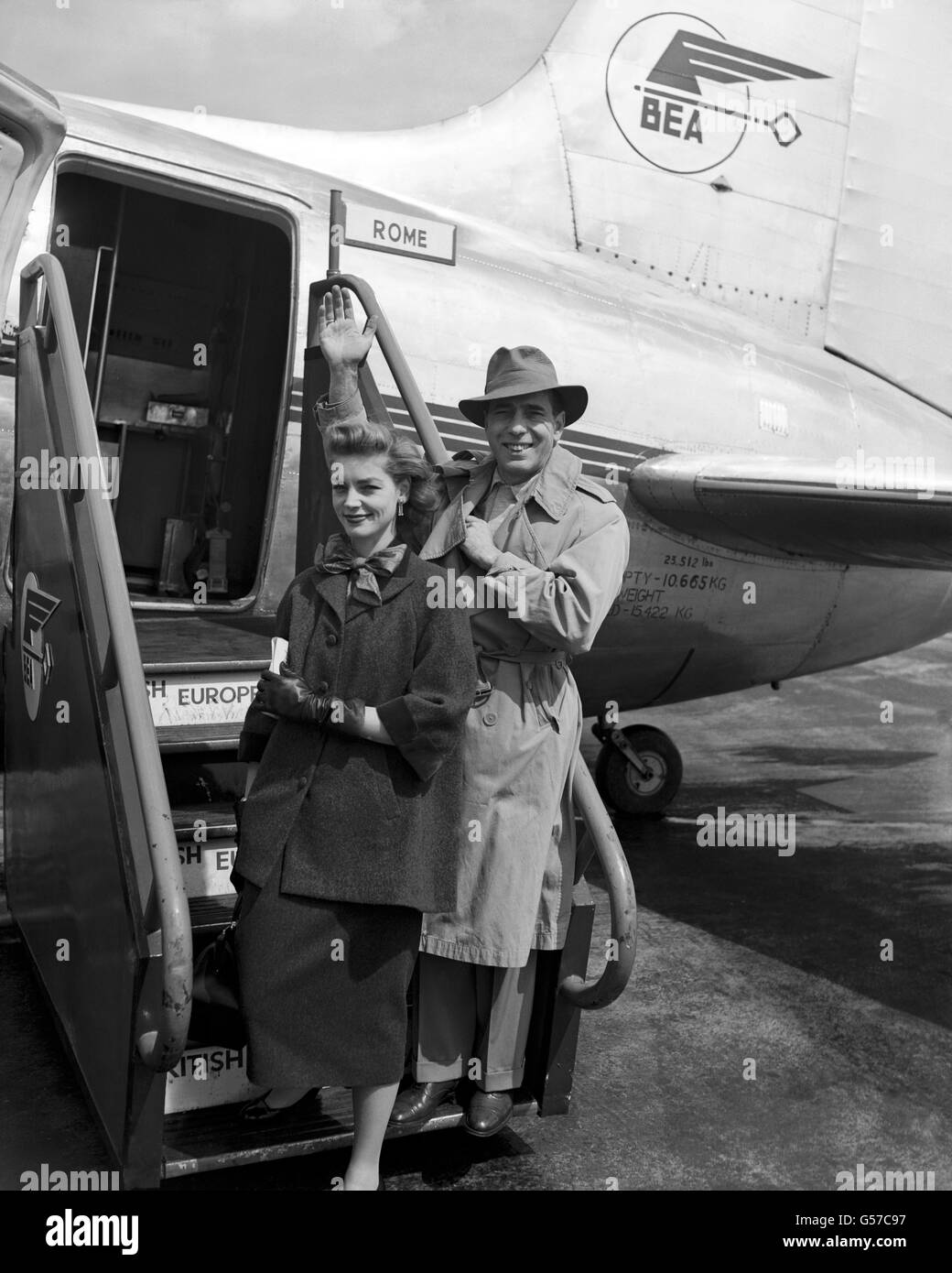American actors Humphrey Bogart and his wife Lauren Bacall, board a BEA Viking for Rome at Heathrow Airport. Stock Photo