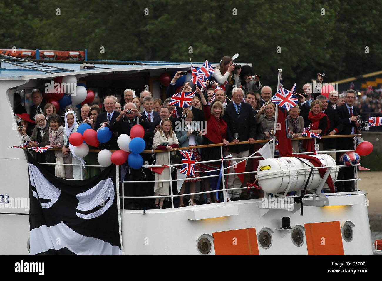 Royal well wisher on a boat during the Diamond Jubilee River Pageant on the River Thames, London. Stock Photo