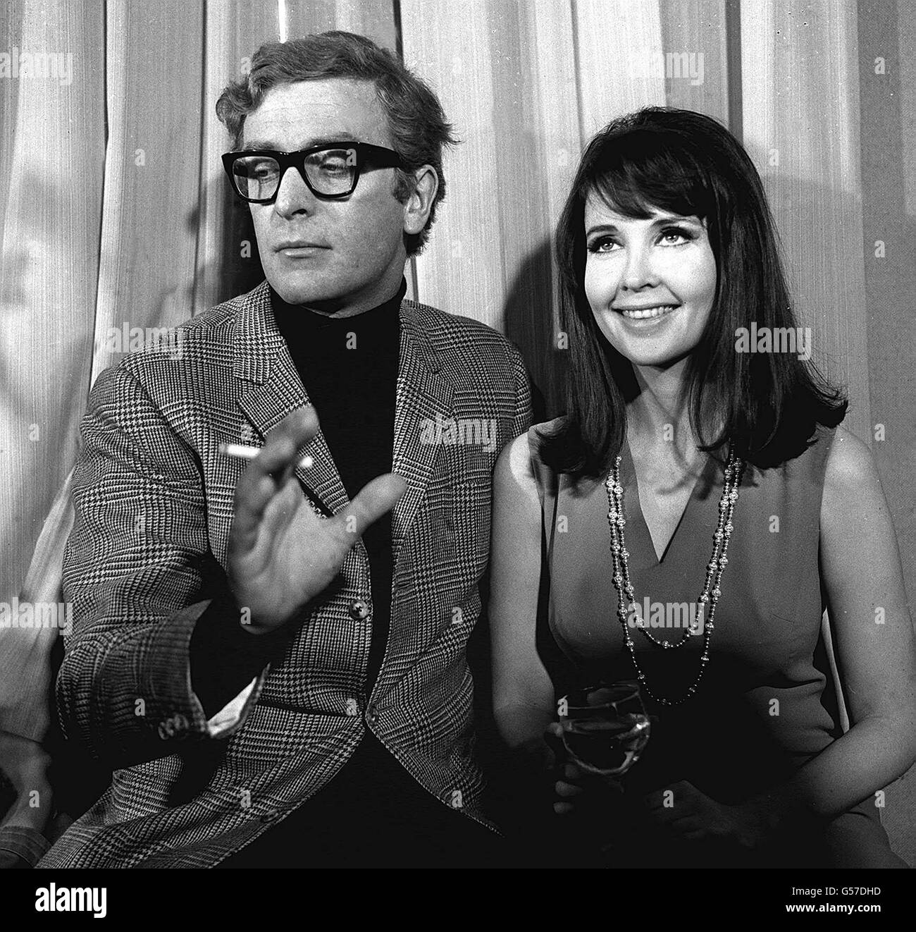 MICHAEL CAINE 1966: Meeting in a London restaurant are Michael Caine and Anjanette Comer who are to play in the film 'Funeral in Berlin', the screen version of Len Deighton's sequel to 'The Ipcress File'. Caine will be recreating the role of spy Harry Palmer. Stock Photo