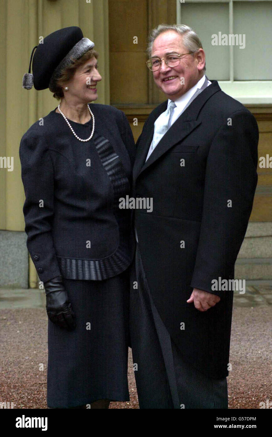 Governor of the Bank of England Sir Edward George with his wife Vanessa at Buckingham Palace after receiving a knighthood from the Queen. * Known until now as Eddie, the new knight of Threadneedle Street said his wife - now Lady George - had always preferred people to call him Edward. Stock Photo