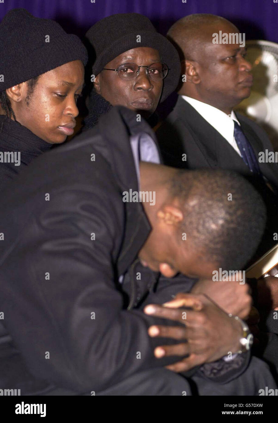 The family of murdered schoolboy Damilola Taylor, from left to right; sister Beme, 23, brother Tunde, 21, mother Gloria and father Richard at the Mountain of Fire and Miracles Ministries in London's Old Kent Road, for the memorial of the 10 year old, who died 10 days ago. Stock Photo