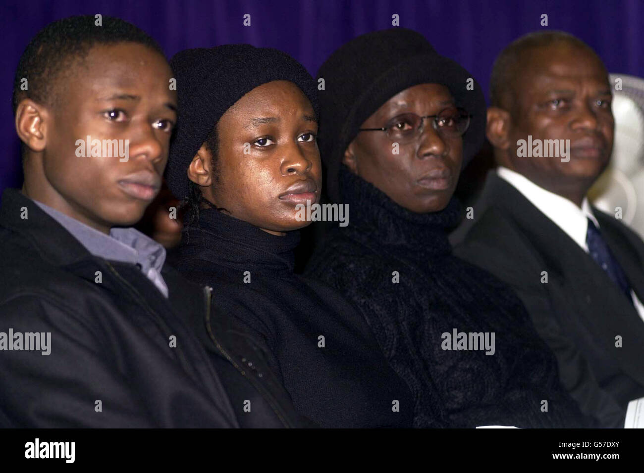 The family of murdered schoolboy Damilola Taylor, from left to right; brother Tunde, 21, sister Beme, 23, mother Gloria and father Richard at the Mountain of Fire and Miracles Ministries in London's Old Kent Road, for the memorial of the 10 year old, who died 10 days ago. Stock Photo
