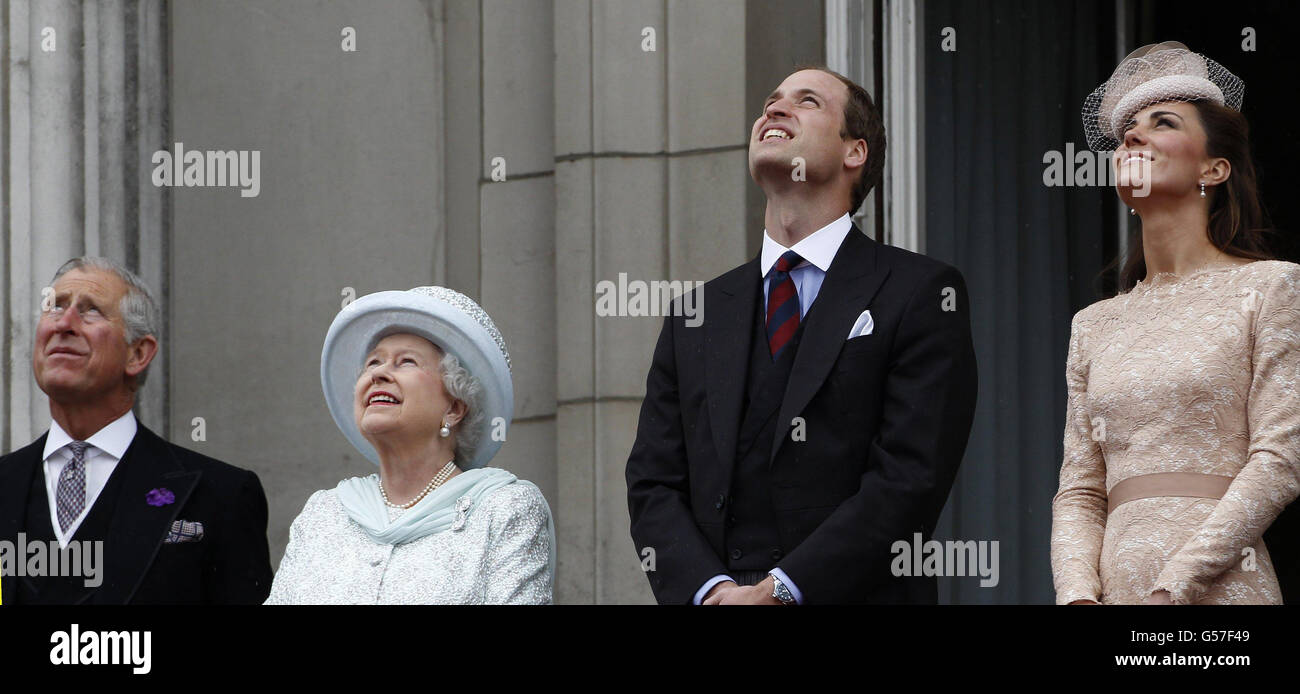 Prince Charles, Queen Elizabeth II, Prince William and Catherine, Duchess of Cambridge watch the military fly past on the balcony at Buckingham Palace during the Diamond Jubilee celebrations in central London. Stock Photo