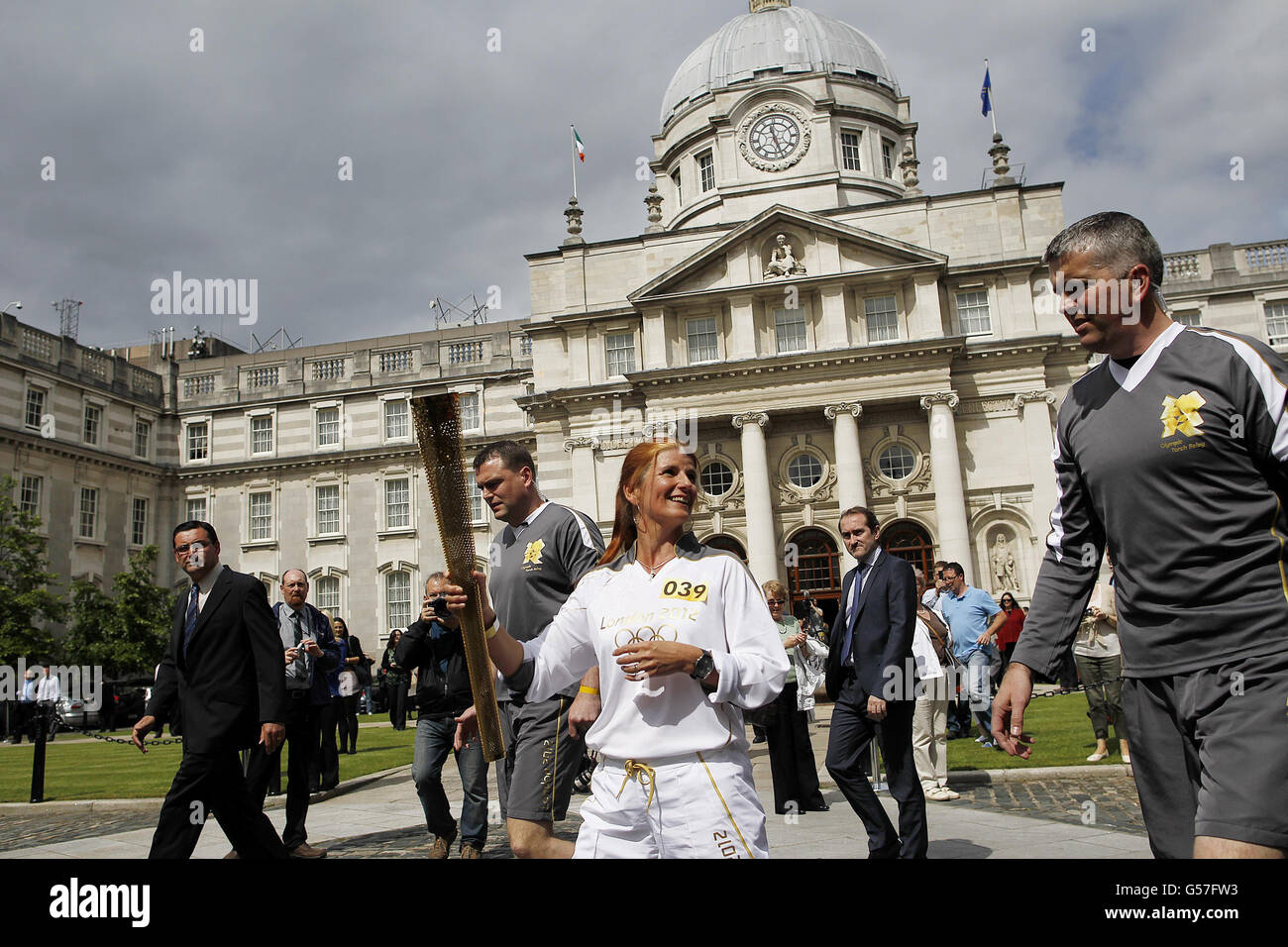 Olympic Flame carrier Bridget Taylor outside Government Buildings on Day 19 of the Olympic Torch relay. Stock Photo