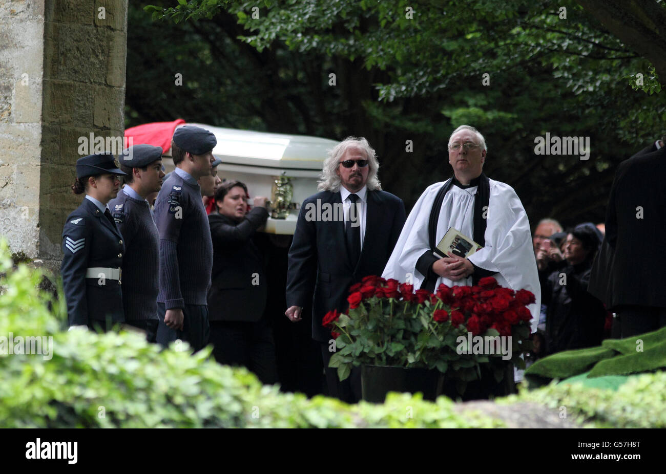Bee Gee Barry Gibb (centre) walks in front of the coffin of his brother Robin Gibb as it is carried from his funeral service at St Mary's Church in Thame, Oxfordshire. Stock Photo