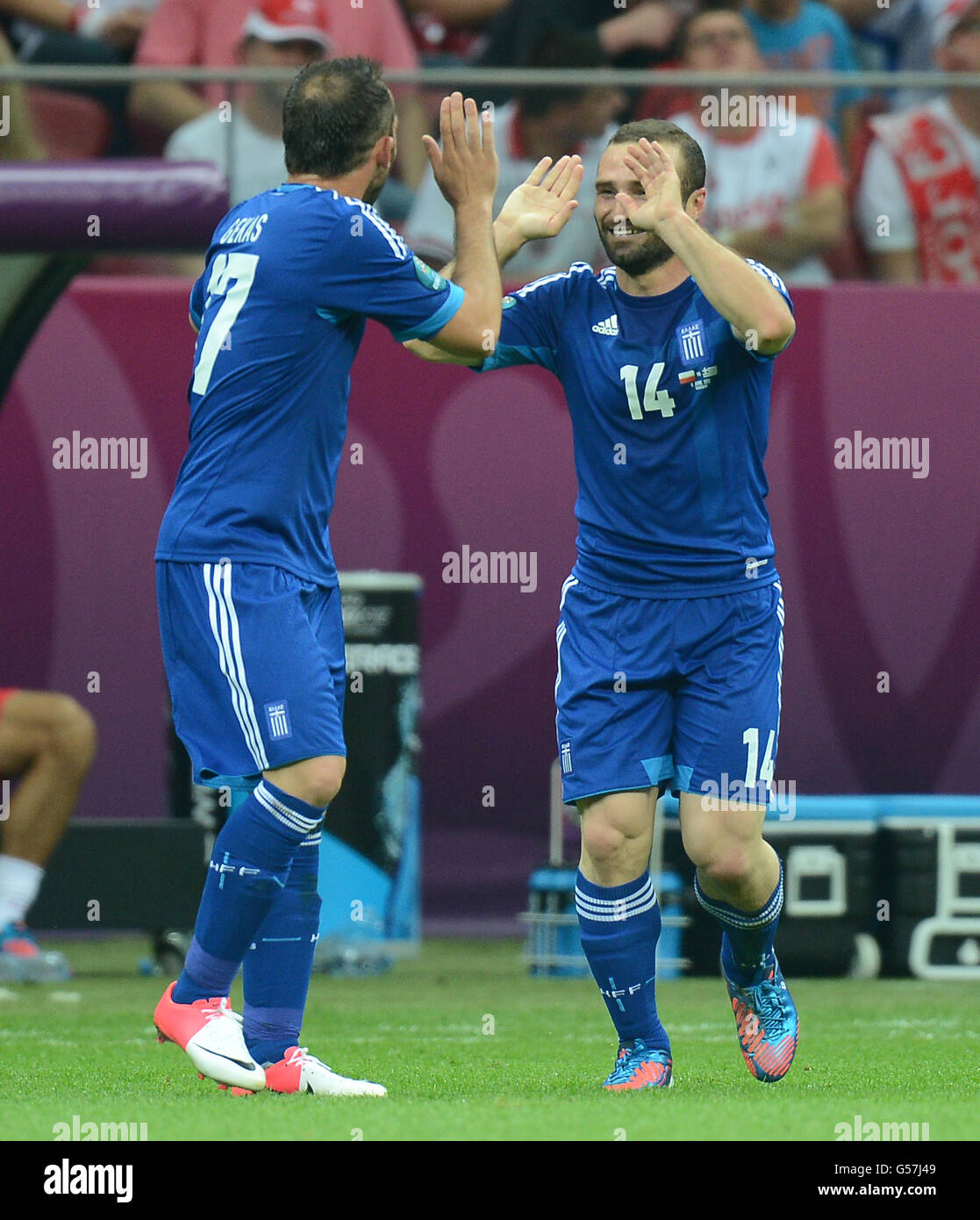 Greece's Dimitris Salpingidis (14) celebrates after scoring with Fanis Gekas (left) Stock Photo