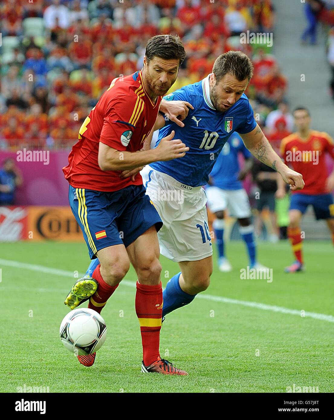 Soccer - UEFA Euro 2012 - Group C - Spain v Italy - Arena Gdansk. Spain's Xabi Alonso (left) and Italy's Antonio Cassano battle for the ball Stock Photo