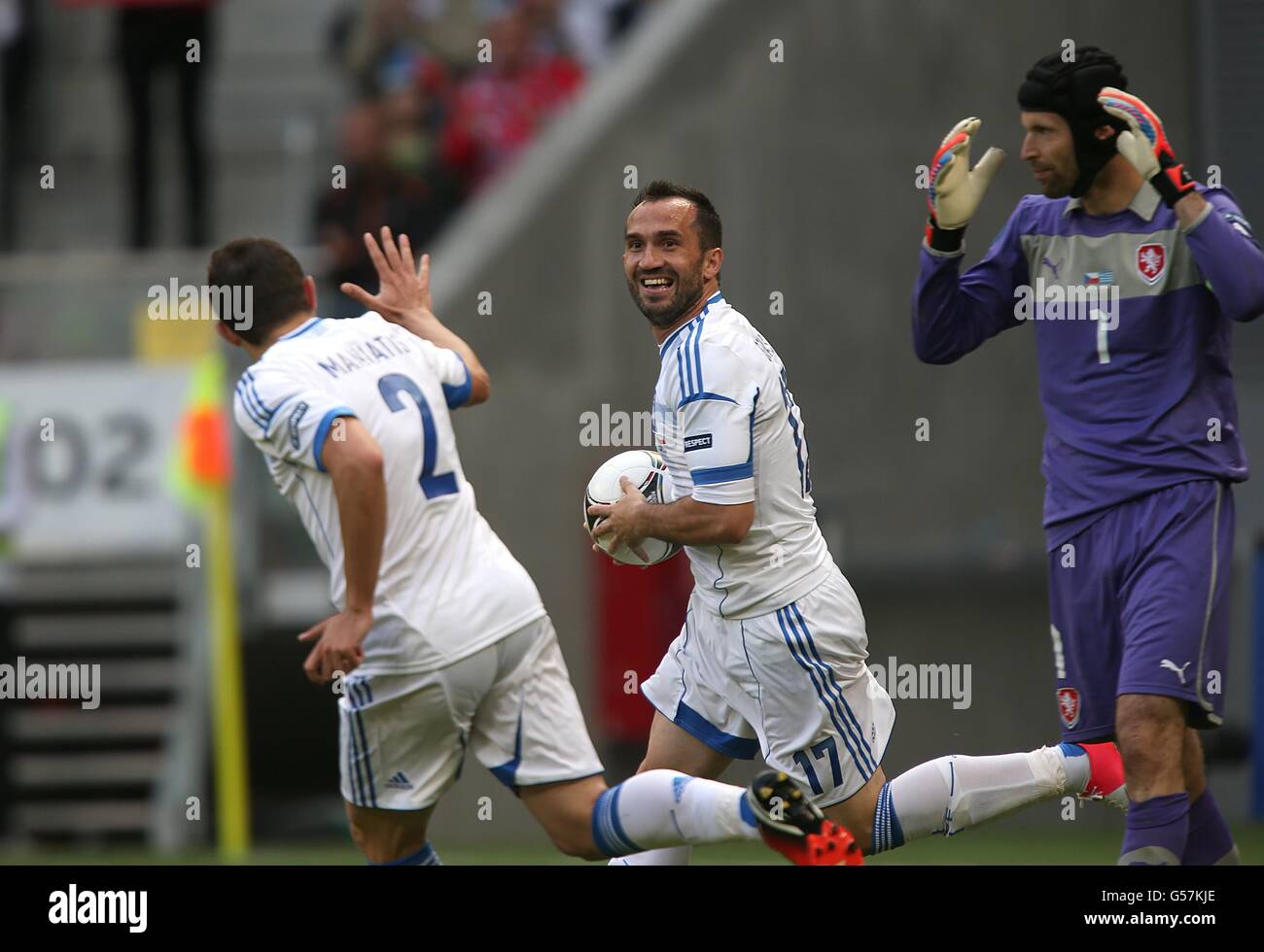 Greece's Theofanis Gekas (centre) celebrates scoring his team's opening goal after Czech Republic's goalkeeper Petr Cech (right) makes an error Stock Photo