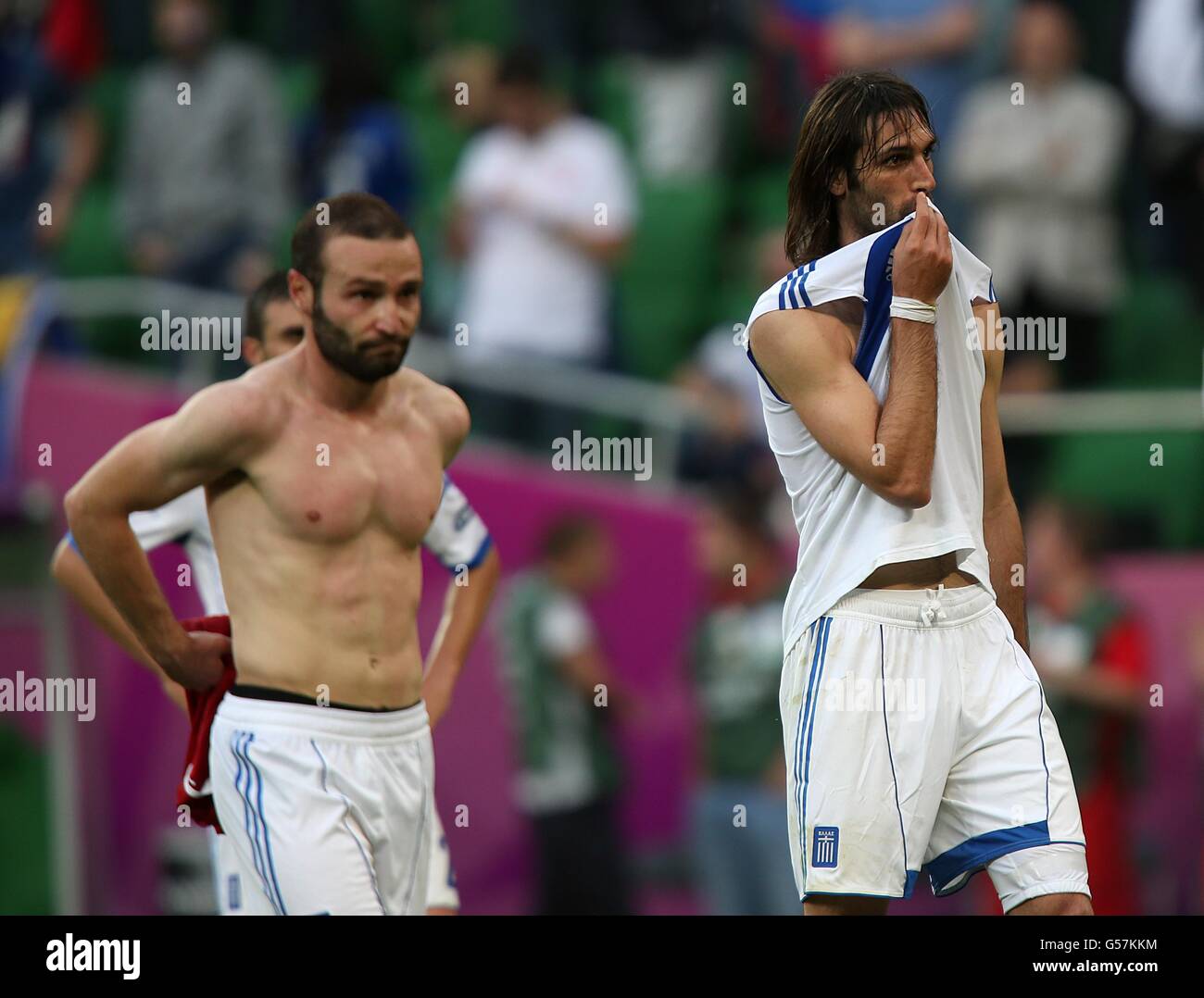 Greece's Dimitris Salpingidis (left) and Georgios Samaras appear dejected after the final whistle. Stock Photo