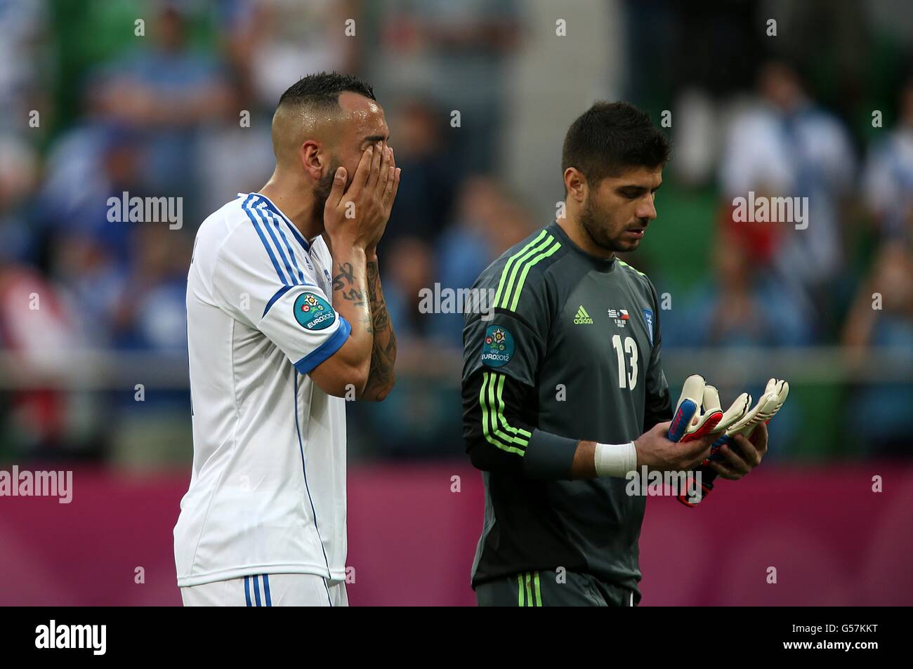 Soccer - UEFA Euro 2012 - Group A - Greece v Czech Republic - Municipal Stadium. Greece's Kostas Mitroglou (left) and goalkeeper Michail Sifakis appear dejected after the final whistle. Stock Photo