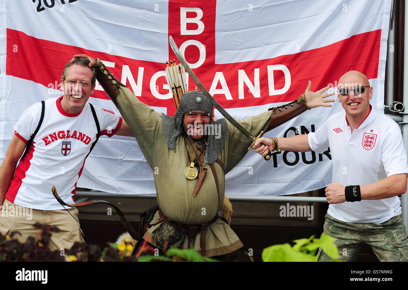 England fans Mick Breheny, 60 (left) from Boldon and Micky Smith from South Shields pose for a photo in the main square in Krakow. Stock Photo