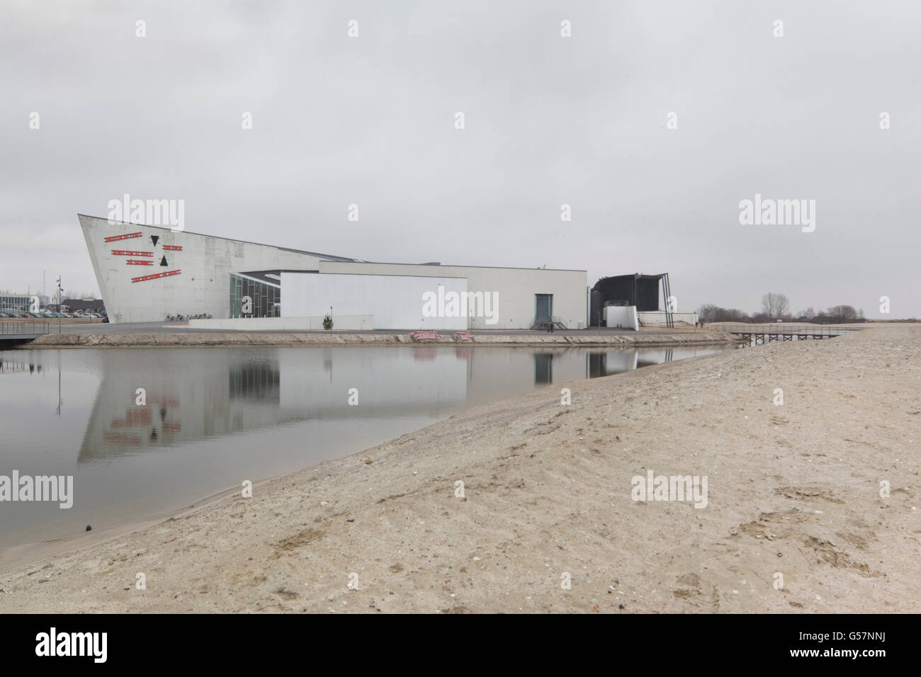 Exterior view with sand dunes and lagoon against cloudy sky (prior ...