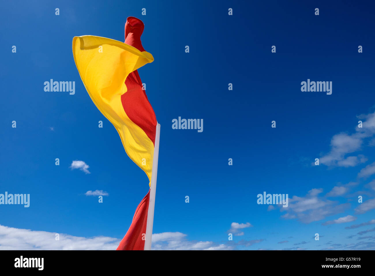 RNLI Safety Flag red and yellow Porthkidney Beach Lelant Cornwall Stock