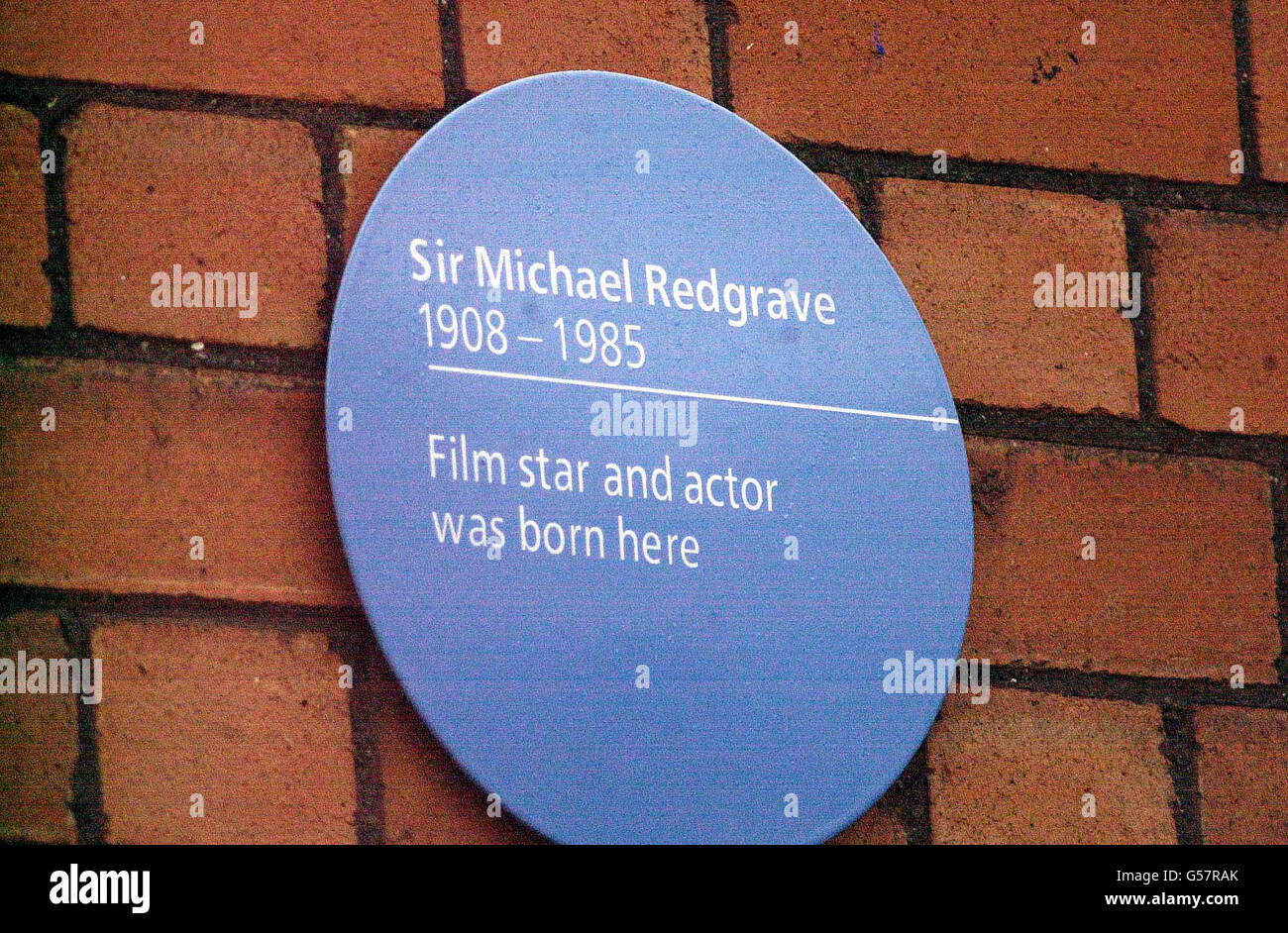 Sir Michael Redgrave was honoured when his Son Corin unveiled a plaque on the house in Horfield Road, Cotham, Bristol, where his father was born in 1908. Mr Redgrave told how Sir Michael was named after St Michael's church, in Bristol. * even though his grandmother only stayed a few days in the house opposite in 1908. Stock Photo