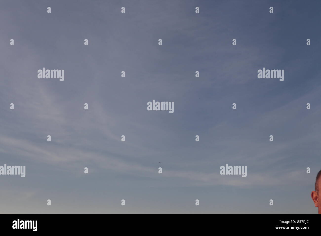 blue sky with a human ear Stock Photo