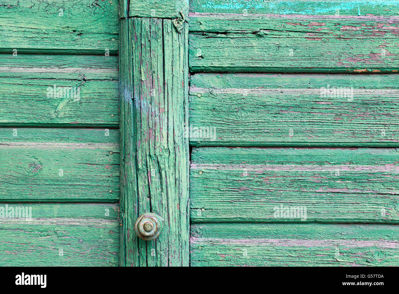 old wooden fence painted in green background Stock Photo - Alamy