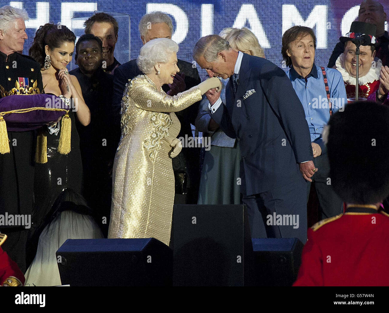 Queen elizabeth ii is greeted by her son, the prince of wales, as