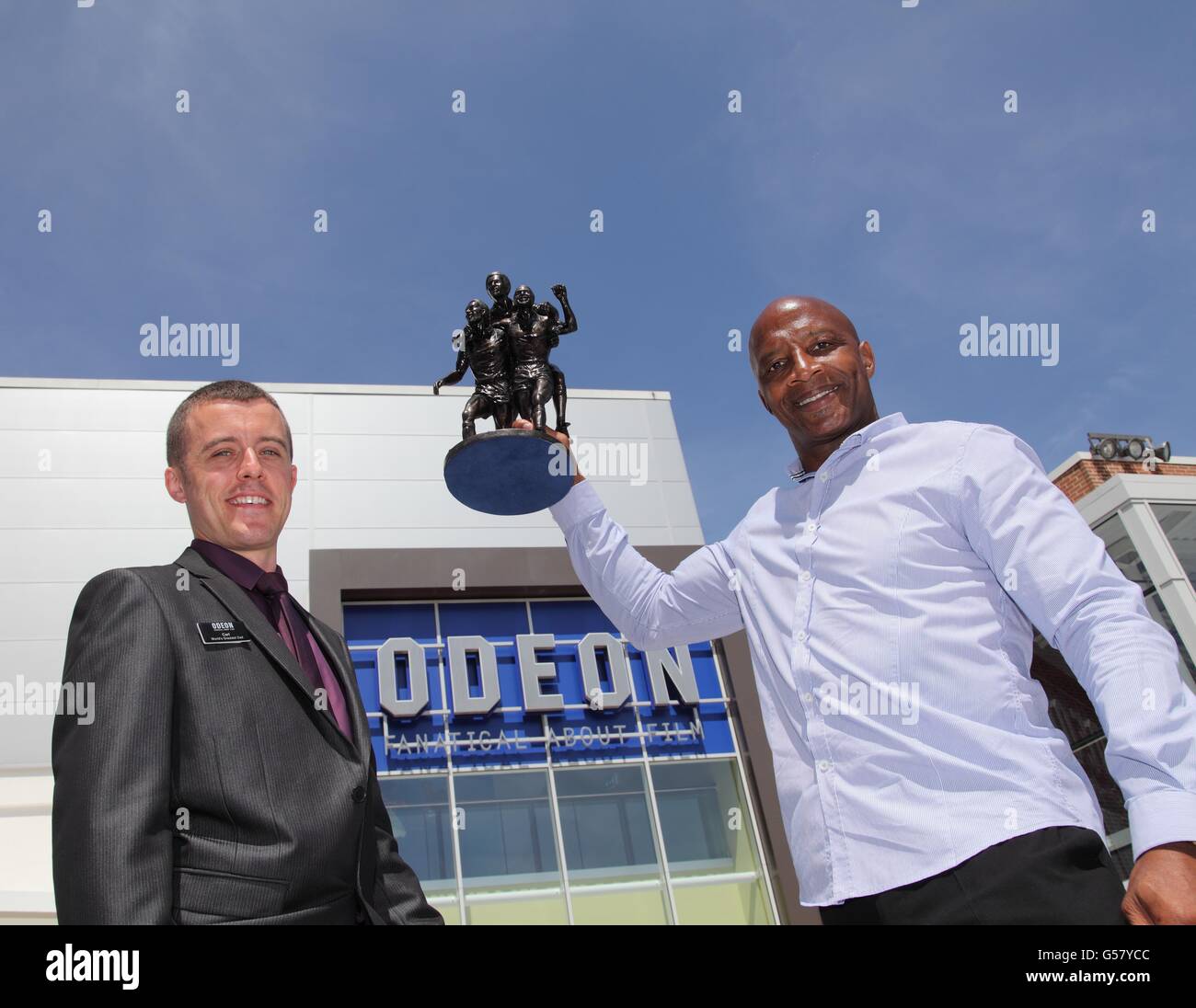 West Bromwich Albion star Cyrille Regis receives a commemorative statuette Stock Photo