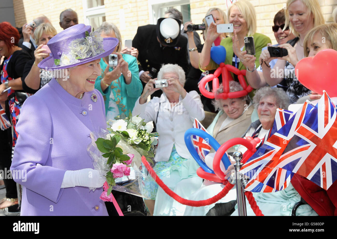Queen Elizabeth II meets members of the public as she visits a new