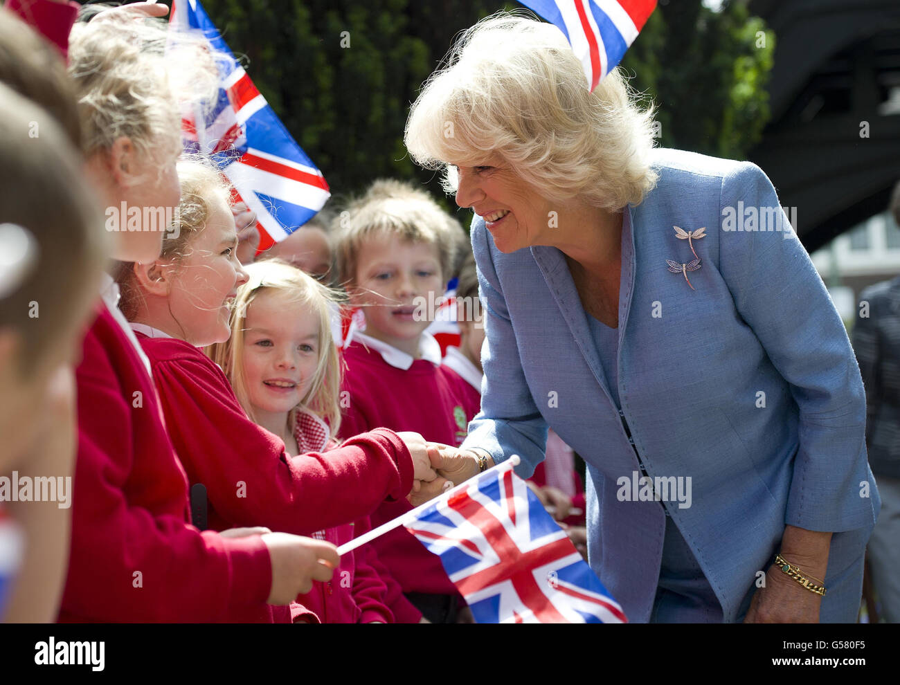 The Duchess of Cornwall meets pupils from Barnes Primary School during a visit to the inaugural Floral Festival of St. Mary's Church, a celebration of The Queen's Diamond Jubilee in flowers in Barnes, south west London. Stock Photo