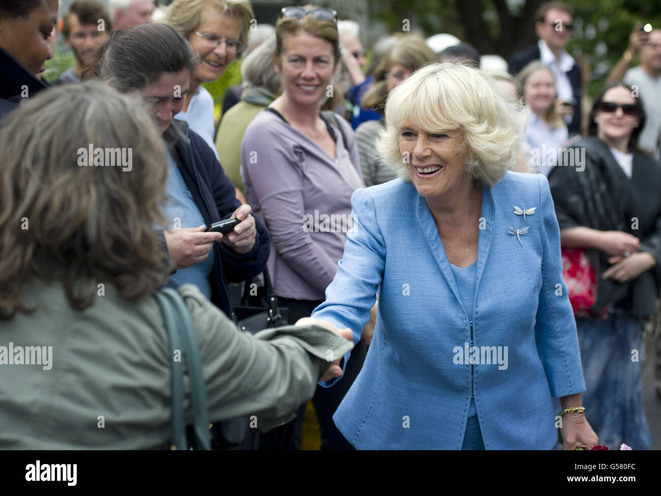 The Duchess of Cornwall meets well wishers as she visits the inaugural Floral Festival of St. Mary's Church, a celebration of The Queen's Diamond Jubilee in flowers, in Barnes, south west London. Stock Photo