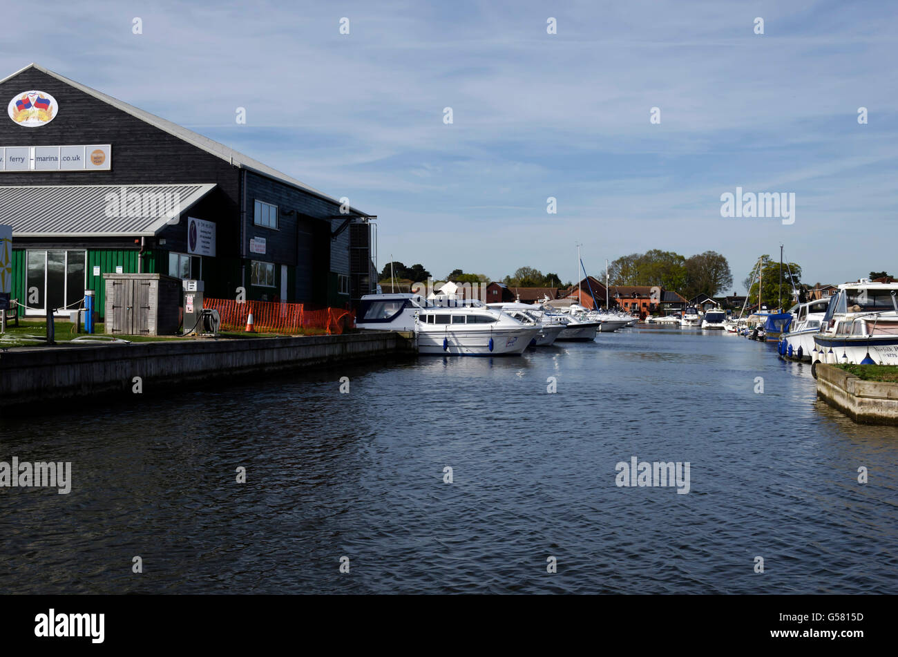 Boatyards on a backwater inlet at Horning on the River Bure in the Norfolk Broads, England. Stock Photo