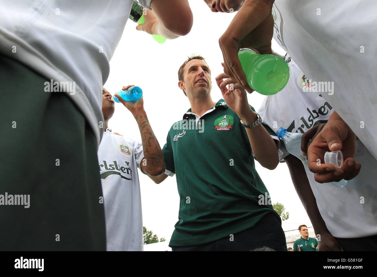 International FC manager Gareth Southgate gives a half time team talk as his side take on a team of European Legends, including former Liverpool midfielder Patrik Berger and Chelsea winger Bolo Zenden, ahead of attending the England versus Sweden game in Kiev on June 15. Stock Photo