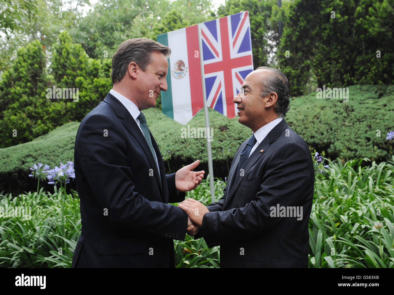 Prime Minister David Cameron is greeted by Mexican President Filipe Calderon (right) at his official residence in Los Pinos, Mexico City, during a two day visit. Stock Photo
