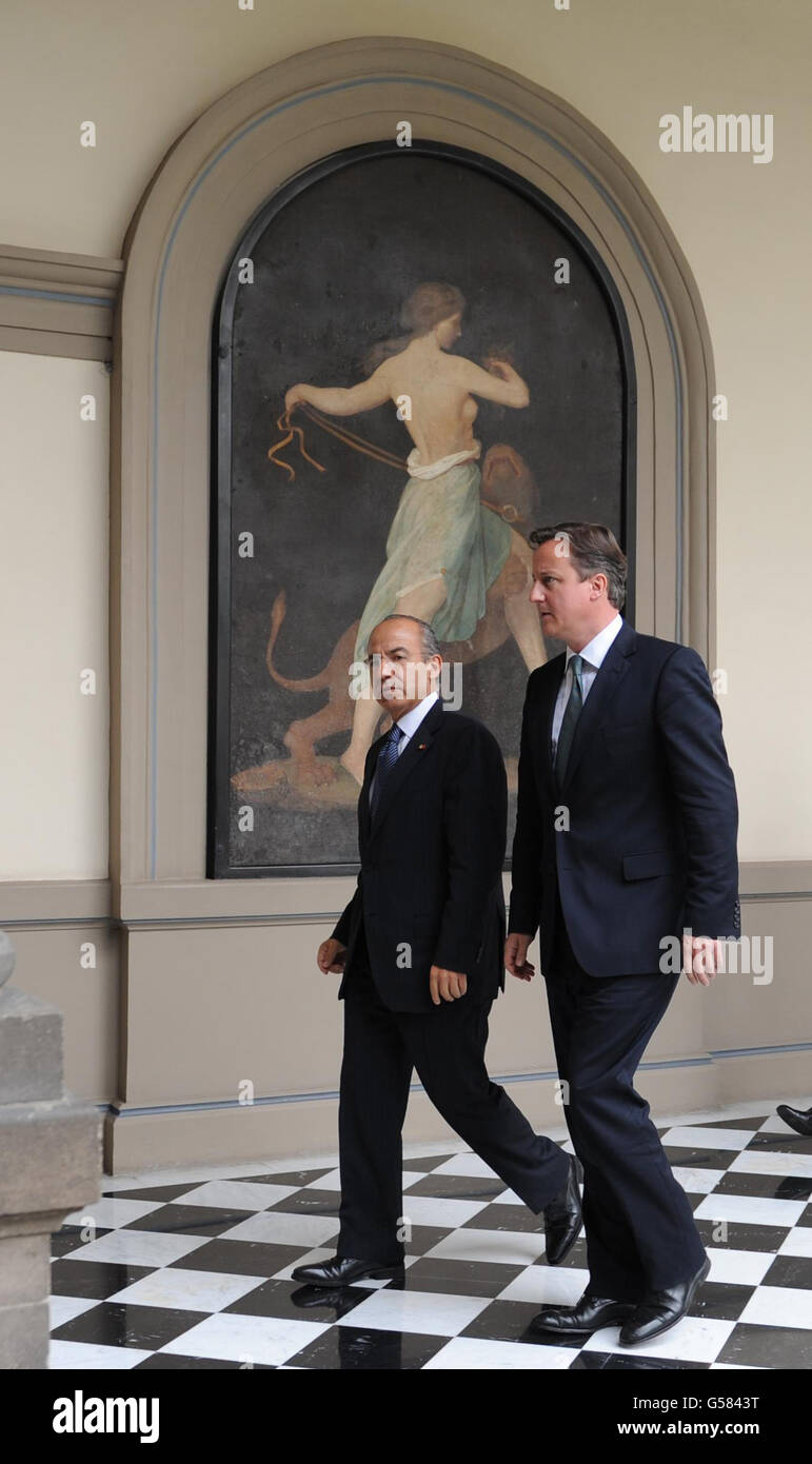 Prime Minister David Cameron is welcomed by Mexican President Filipe Calderon (left) to an official lunch at a former Presidential Palace, Chapultepec Castle in Mexico City during a two day visit. Stock Photo