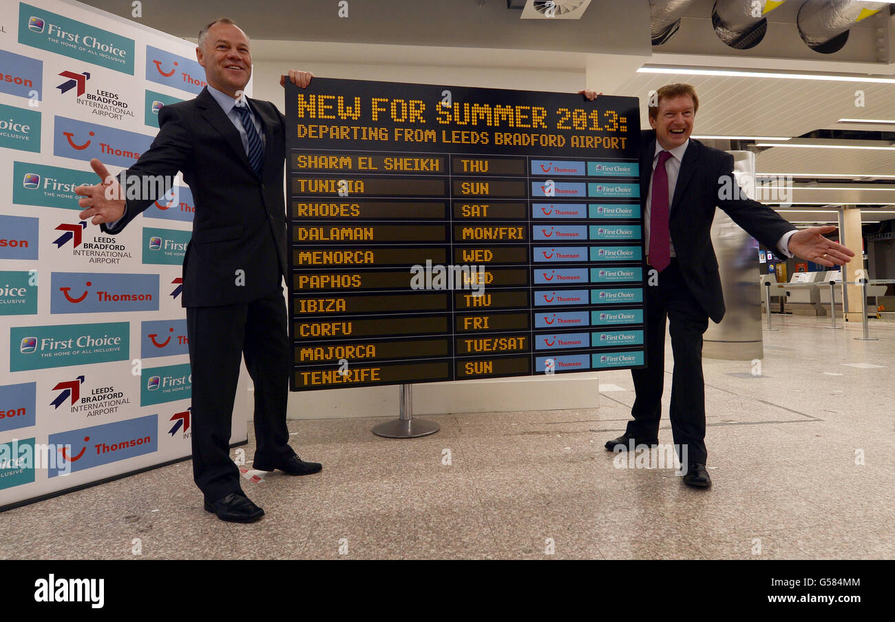 Airport negotiations Manager for Thomsons and First Choice Paul Cooper (left) shows the new departures with Leeds Bradford Airport Marketing Director Tony Hallwood at a media conference at the airport today where Thomson and First Choice Holidays announce their new routes from Leeds Bradford Airport which due to begin in summer 2013. Stock Photo