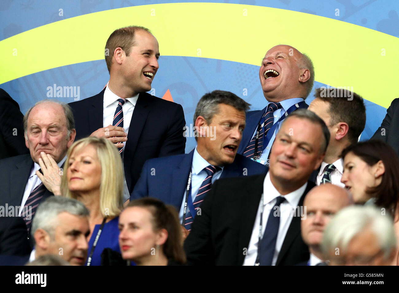 The Duke of Cambridge shares a laugh with FA chairman Greg Dyke (right) in the stands during the UEFA Euro 2016, Group B match at the Stade Geoffroy Guichard, Saint-Etienne. Stock Photo