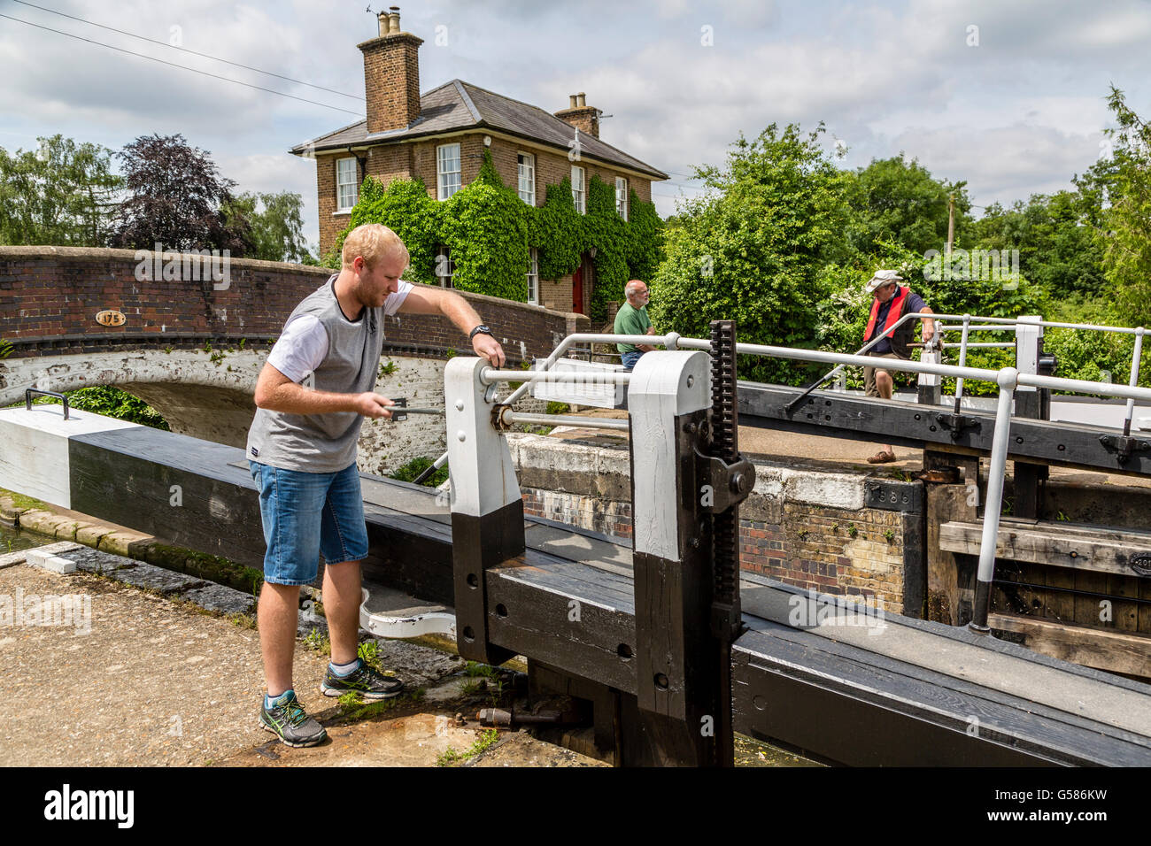 Closing the paddle gate at Stockers Lock Grand Union Canal London England UK Stock Photo